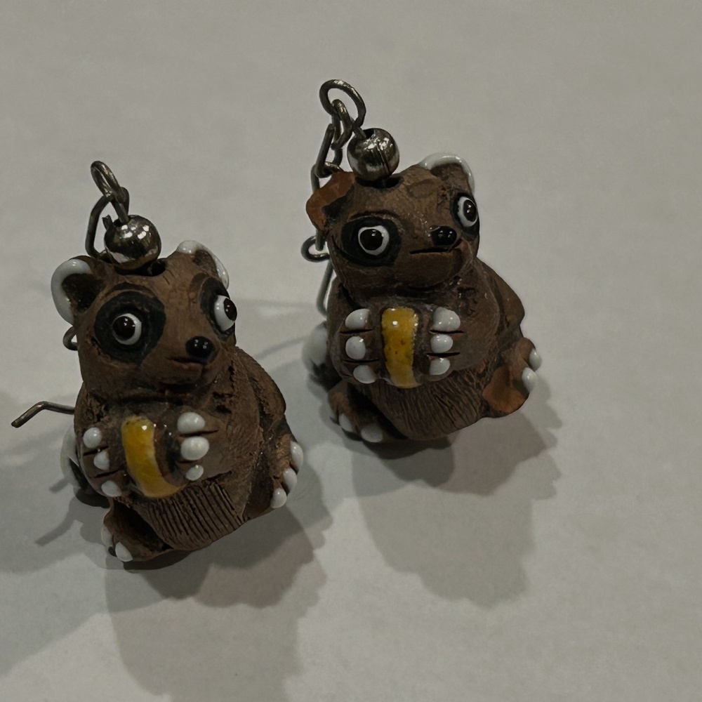 Fun carved and painted raccoon earrings